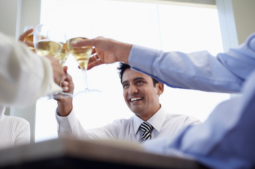 Businessman With Colleagues Toasting Wineglasses