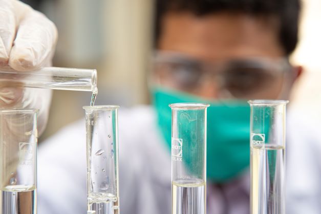 scientist in a lab (pic from Unsplash)