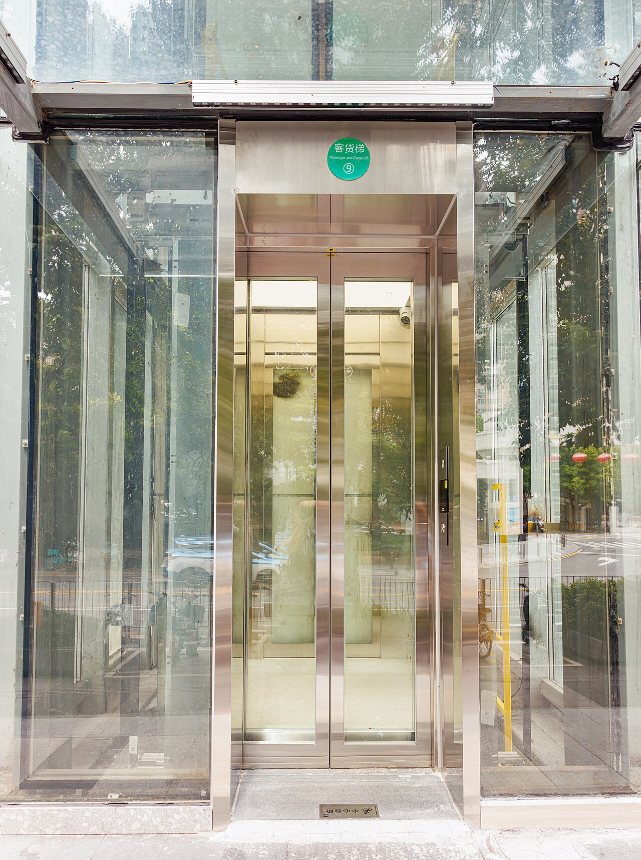 Glass-fronted elevator entrance in an office building