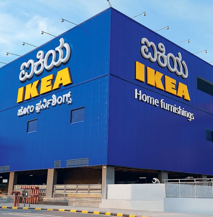 The blue exterior of an IKEA store in Bengaluru with the IKEA name in Kannada and English above the words home furnishings