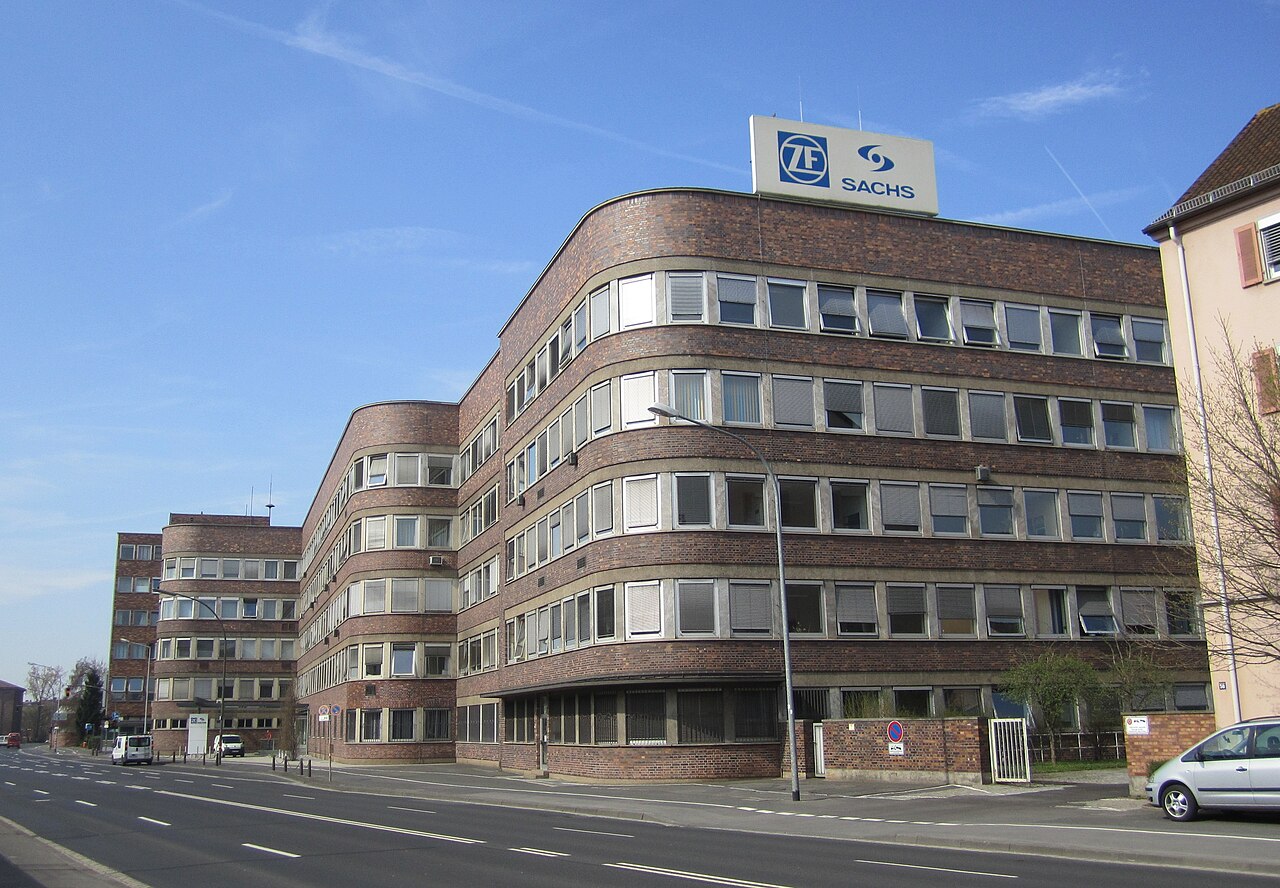 A brick ZF Sachs office building with a ZF sign on the roof, seen from a street in Schweinfurt, Germany