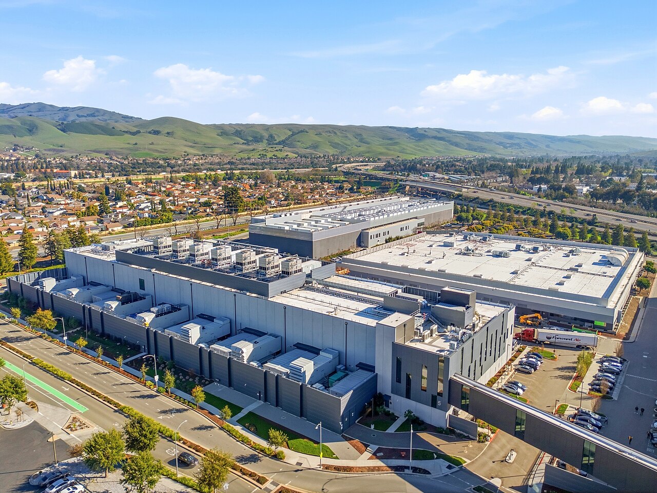 Aerial view of an Equinix data center campus in Silicon Valley, California, with hills in the background